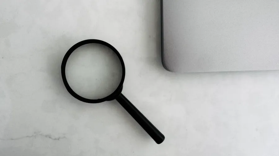 Is your website ready for AI search — magnifying glass over a laptop