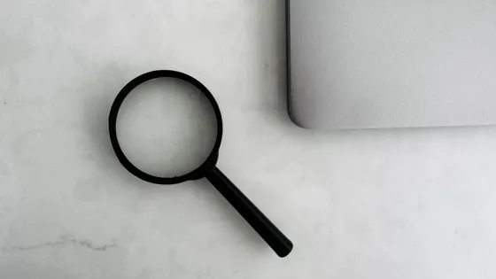 Is your website ready for AI search — magnifying glass and laptop