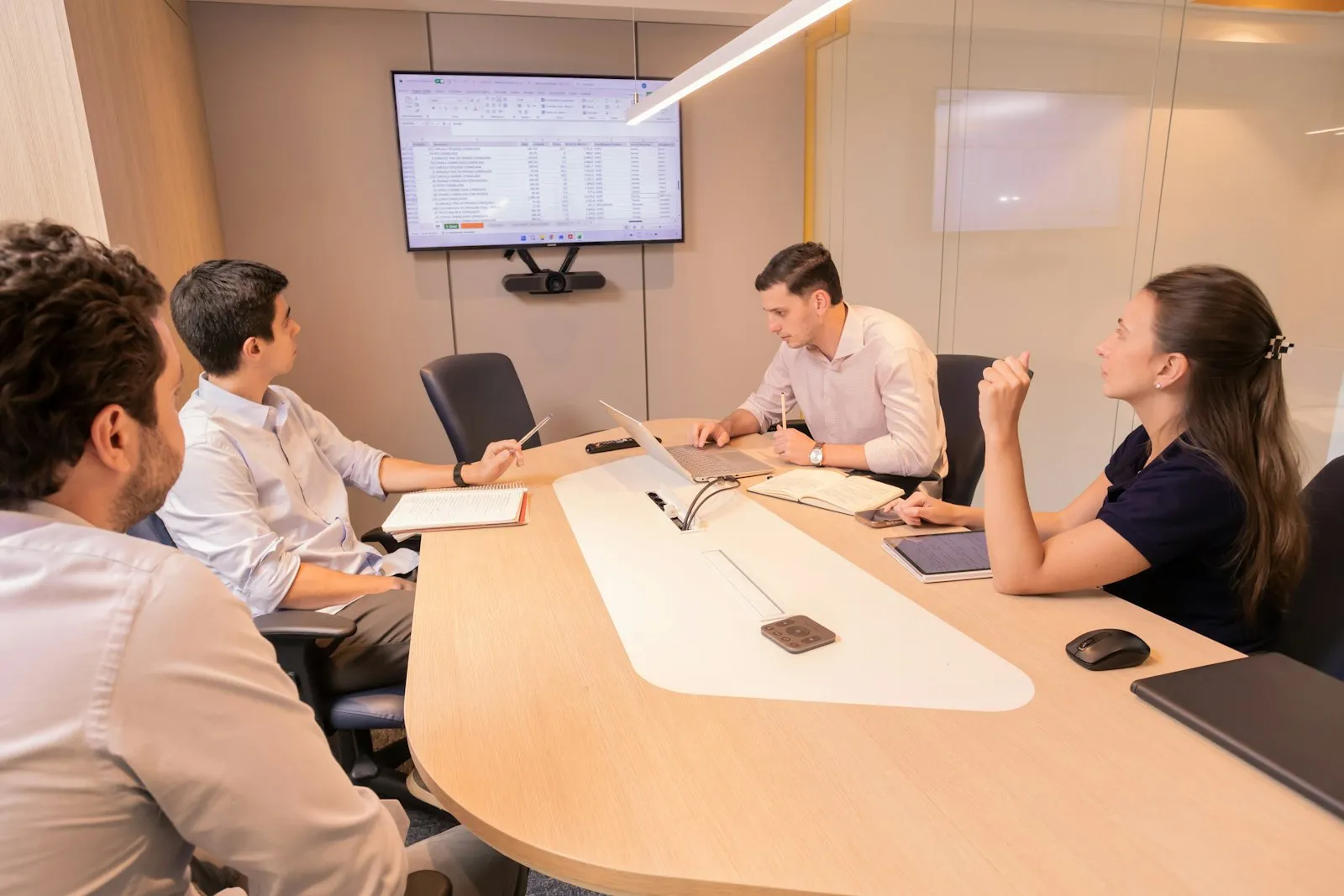 A B2B marketing team planning campaigns around a conference table