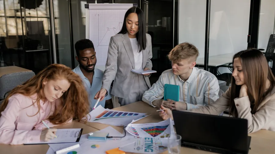 Founder comparing a fractional CMO, a marketing agency, and a managed marketing service in a strategy meeting