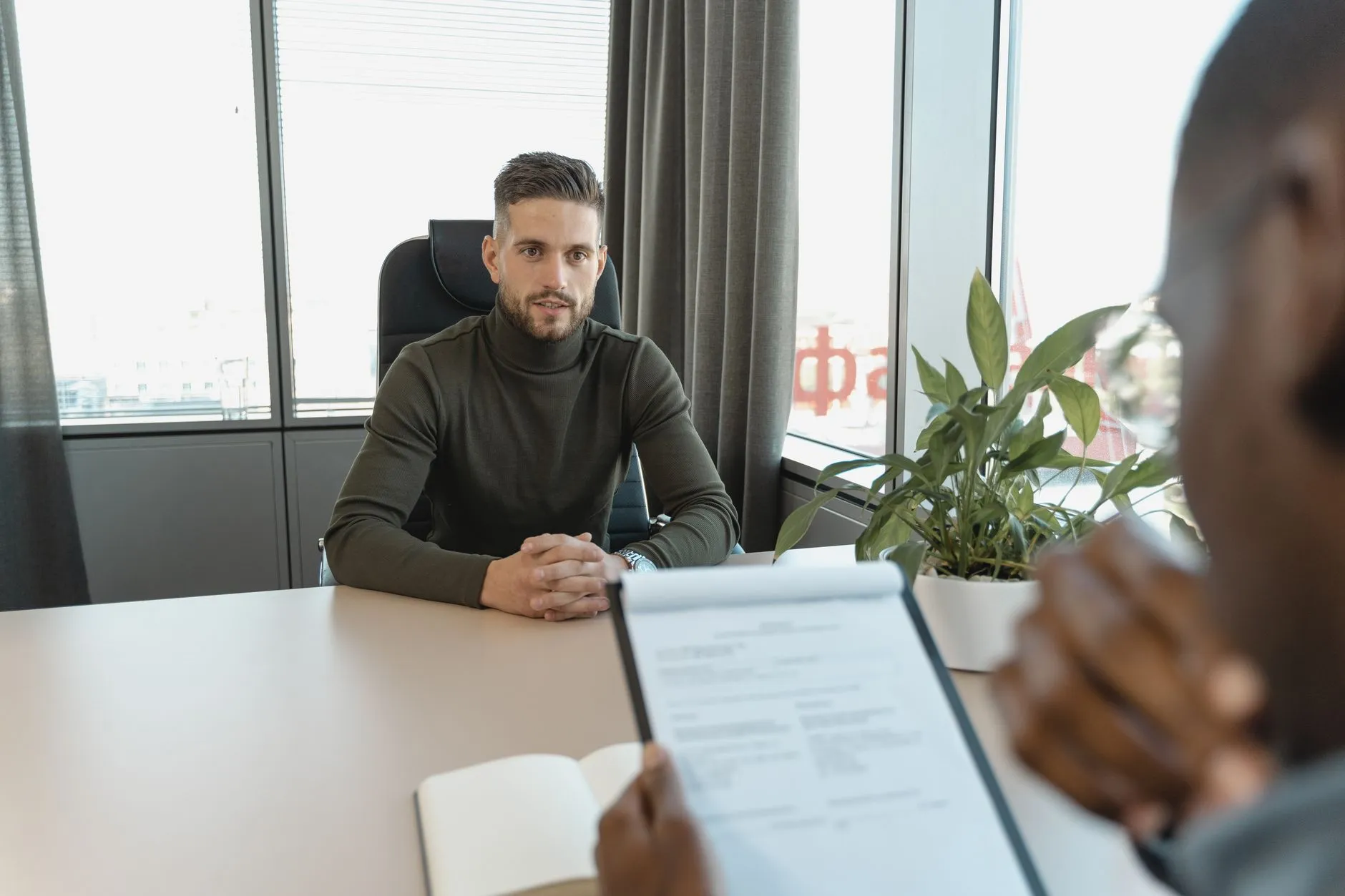 Professional in a modern office, representing the kind of senior marketing leader a fractional CMO engagement brings to a small business