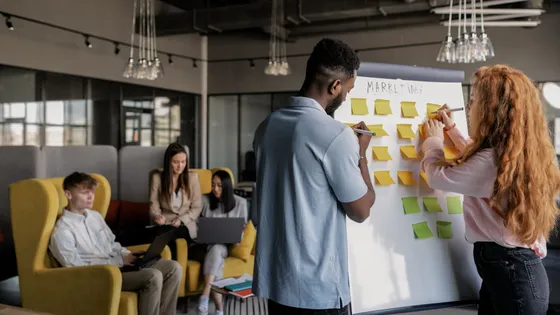 A startup team mapping priorities on a whiteboard, narrowing focus to the vital few activities that drive most of the results