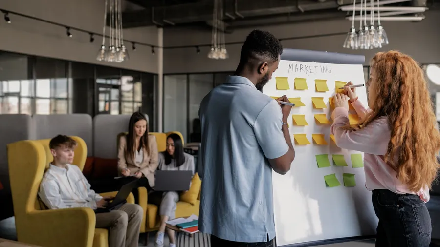 A startup founder narrowing a long list of priorities down to the few that matter, applying the 80/20 rule to focus limited time and budget