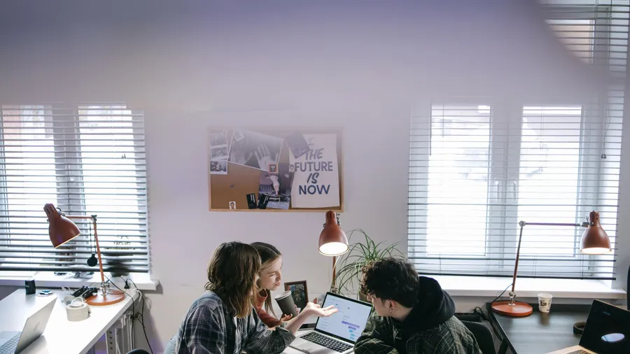 A startup team working together on the consistent, stage-appropriate execution that sustains a compounding SaaS growth trajectory