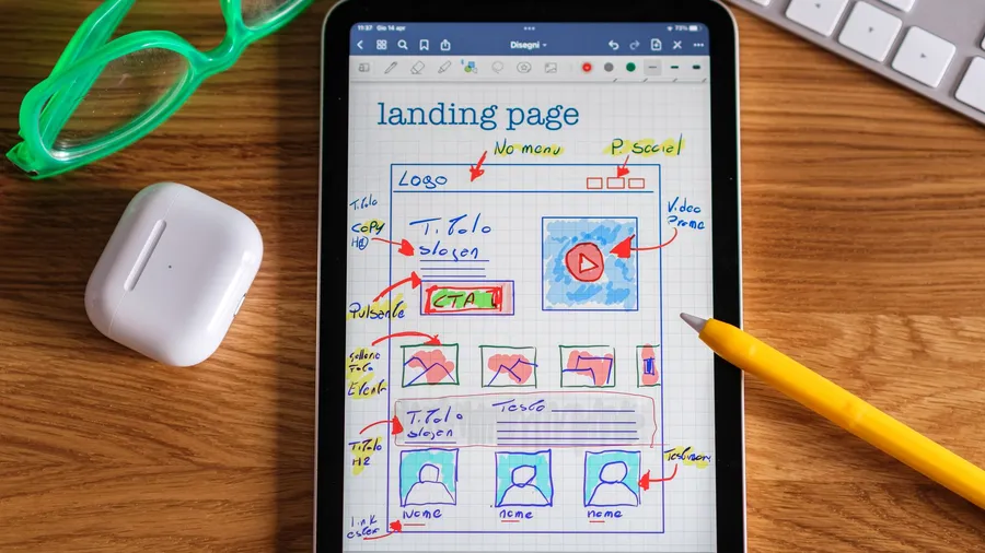 Small business owner comparing website pricing plans on a laptop at a desk, weighing DIY builder, freelancer, agency, and managed website costs