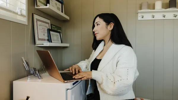Small business owner deciding who to hire for marketing